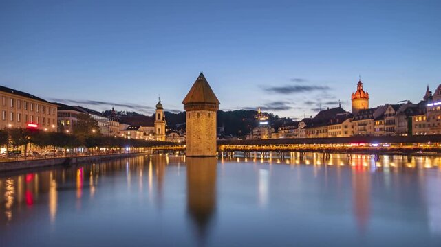 Day to night long exposure time lapse panorama Lucerne old town and Chapel bridge, Switzerland.