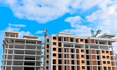 Monolithic construction site with crane and sky