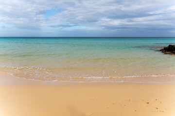 Fototapeta premium Fuerteventura island Canary islands Spain Corralejo natural park with golden sand and clear water on the beach