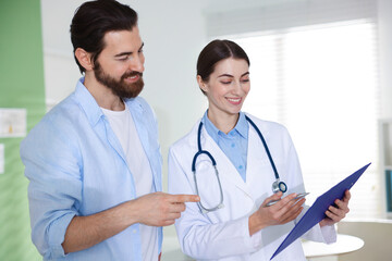 Fototapeta premium Man having appointment with doctor in clinic