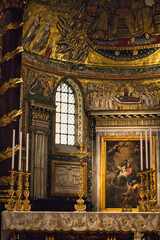 The high altar and magnificent baldachin of Basilica di Santa Maria Maggiore in Rome, featuring ornate porphyry columns, gold leaf decorations, and the confession crypt below the sanctuary. © Markiian Pankiv