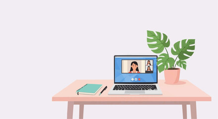 Fototapeta premium Virtual meeting setup on pink desk with laptop, notebook, and plant 