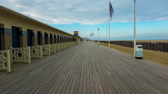 Changing booths bearing the names of Hollywood actors line the boardwalk promenade Les Planches in Deauville, France, October 20, 2025. High quality 4k footage