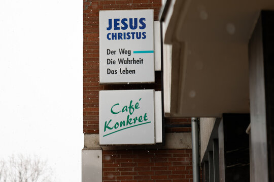 Jesus christus cafe konkret signs on brick building