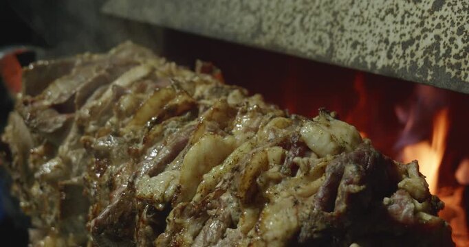 Close Up of Cag Kebab Rotating on Wood Fire