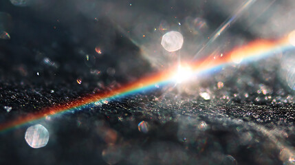 Fototapeta premium Rainbow Light Spectrum and Bokeh on Dark Textured Surface