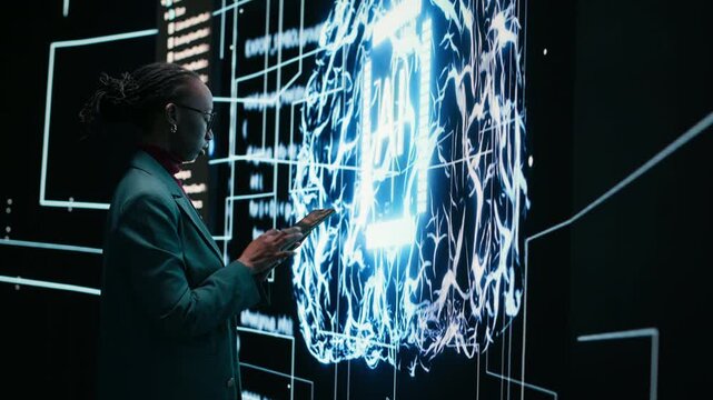 Technician implements digital guardrails on autonomous AI system using tablet to limit risk. African american woman applies artificial intelligence safety constraints with device