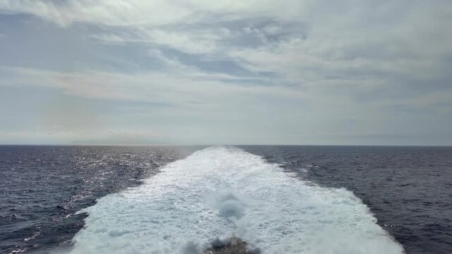 Ferry Wake Over Open Ocean with Horizon