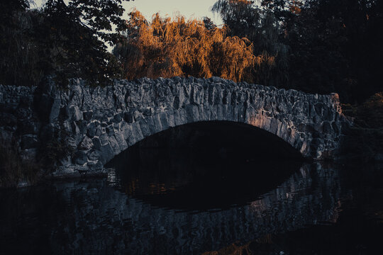 Stone bridge with water reflection