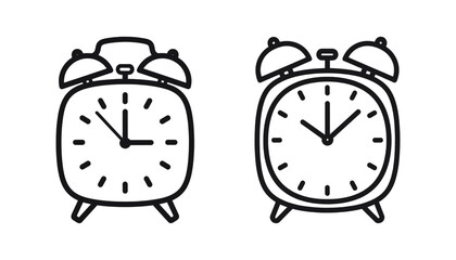 Two simple black and white analog alarm clocks side by side
