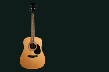 Fototapeta premium Acoustic guitar on black background