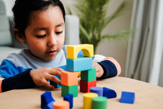 Young asian kid playing with color blocks at home - Kindergarten educational games