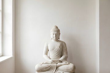 Serene White Buddha Statue in Minimal Calm Interior Space