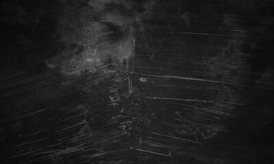 Black concrete texture as a concept of horror and Halloween. Dark wall background cement or stone.