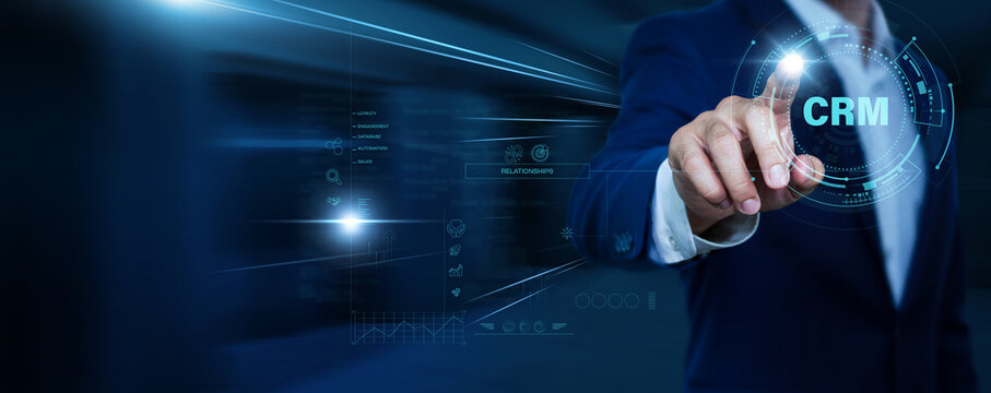 Businessman touching CRM and network. Client management, sales tracking, business analytics, customer engagement, enterprise technology concept.