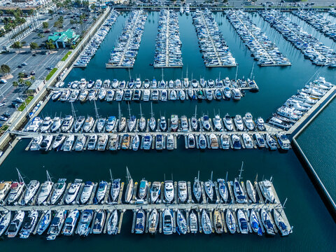 Wide aerial panorama of Long Beach harbor and marina with waterfront homes, yacht docks and Pacific coastline, real estate investment and coastal development concept