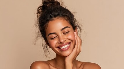 Image of a smiling Mexican girl receiving a beauty treatment against a beige backdrop Attractive mixed race woman gazing at the camera with space for text Carefree multiethnic female