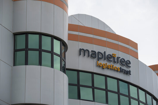 Exterior of a modern industrial warehouse facility belonging to Mapletree Logistics Trust in Singapore. High-quality logistics infrastructure for supply chain and e-commerce distribution