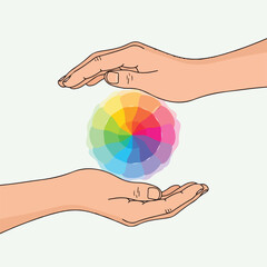 Fototapeta premium Two hands are holding and encircling a colorful color wheel