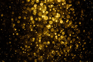 Blurred photo with golden dots visible glittering, shining brightly look and feel luxurious