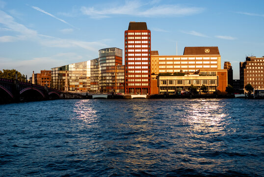 London cityscape along river thames at sunset