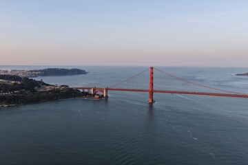 Fototapeta premium Golden Gate Bridge over Pacific Ocean in San Francisco, California at sunset aerial view. g.
