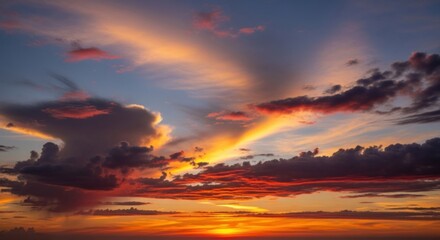 Fototapeta premium A vibrant sunset with a rainbow arching over a dramatic sky filled with clouds and a few scattered stars.