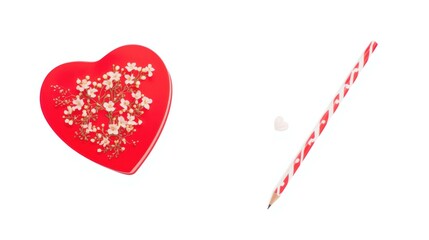 Decorative heart candy box and striped candy cane on white background