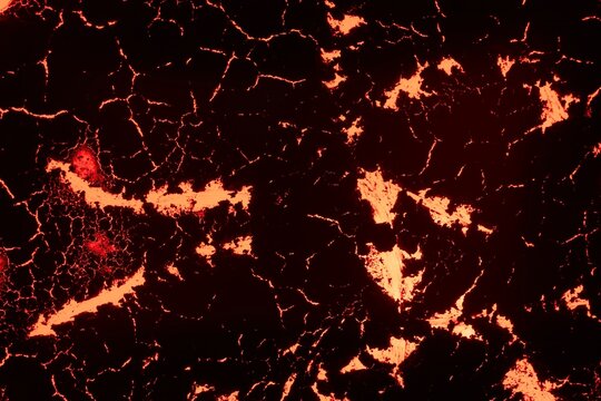 Texture of molten lava on black rock