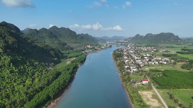 Phong Nha &ndash; Ke Bang National Park, Bo Trach, Quang Binh, Central Vietnam &ndash; 4K aerial footage of UNESCO Heritage site with Son River, limestone karst mountains, rice fields, tropical forest & cave