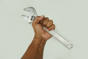 Adjustable Wrench in Hand for Repair and Maintenance Concept