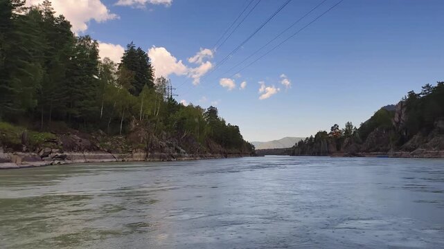 A motorboat ride along mountain river. Altai river Katun near Patmos island in Chemal.
