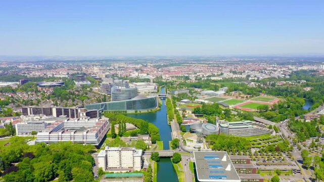 Strasbourg, France. Orangerie Park. The complex of buildings is the European Parliament, the European Court of Human Rights, the Palace of Europe. Drone footage, Departure of the camera