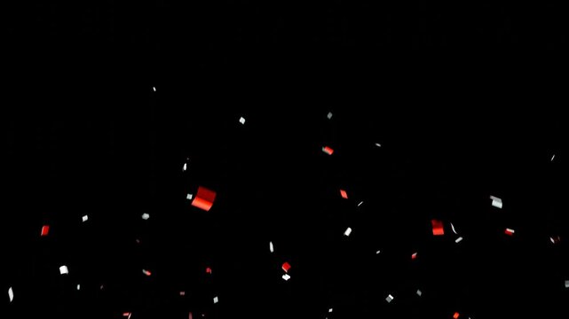 red/white confetti falling in slow motion 3d rendering confetti particle flying include alpha matte. Double burst of confetti.