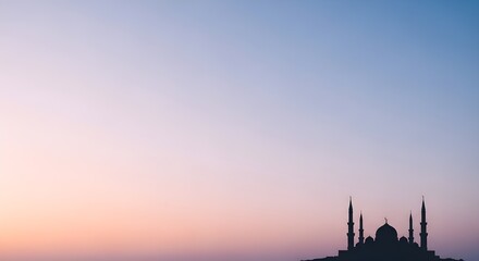 Islamic background for Ramadan Kareem or Eid Mubarak with mosque silhouette at dusk