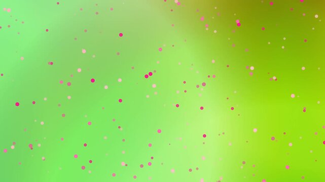 Red particles scattered across a vibrant green background from a close-up viewpoint