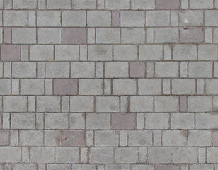 Obraz premium Close-up of old stone pavement with worn texture and mortar