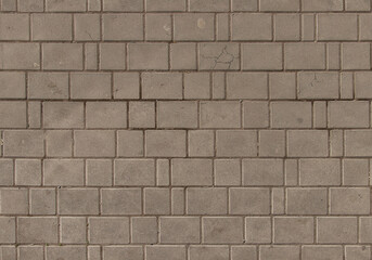 Obraz premium Rectangular stone wall with weathered texture in outdoor setting
