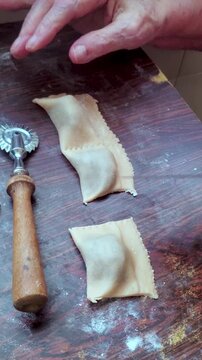 Chestnut Panzerotti Italian dessert filled,seal and cut dough with vintage pasta cutter. pastry shell. Common at Christmas, filled with chestnut or chickpea puree, chocolate, and liqueur