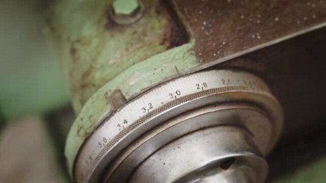 Macro of Rotating Micrometer Dial on Vintage Industrial Lathe Machine