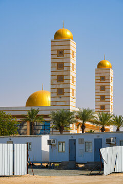 The modern Sharbatly Mosque with golden domes in King Abdullah Economic City (KAEC), Saudi Arabia