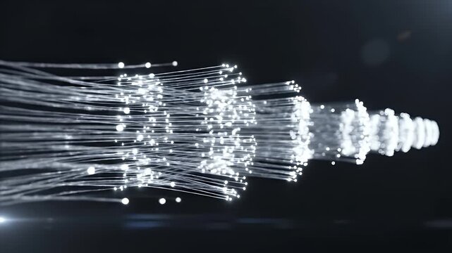 An abstract depiction of light trails, likely fiber optics, glowing against a black backdrop