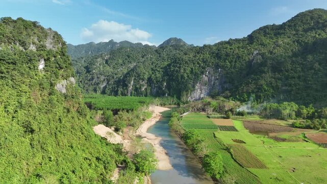 Phong Nha &ndash; Ke Bang National Park, Bo Trach, Quang Binh, Central Vietnam &ndash; 4K aerial footage of UNESCO Heritage site with Son River, limestone karst mountains, rice fields, tropical forest & cave