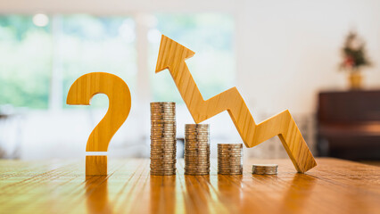Question mark with stacks of coins and upward arrow on wooden table. Concept of investment...