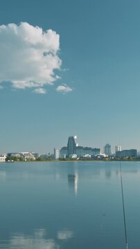 Minsk, Belarus. Reservoir Drozdy. Time Lapse View On Forest, Public Park And City On Background. People Resting Walking At Riverside In Summer Day. City Pond And Park.