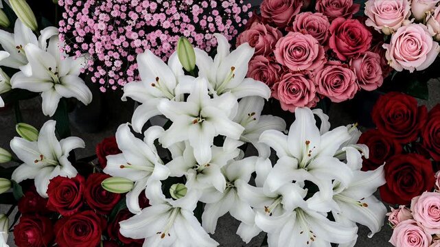 Overhead Shot of Assorted Colorful Flowers Including White Lilies Pink and Red Roses Arranged in Vibrant Floral Display for Wedding or Gift Use