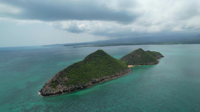 Circular aerial view over the islet of Cabras with the S&atilde;o Tom&eacute; coast in the background.Africa