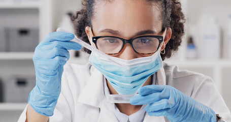 Woman, scientist and dropper with sample at lab for medical research, glasses and virus in petri...