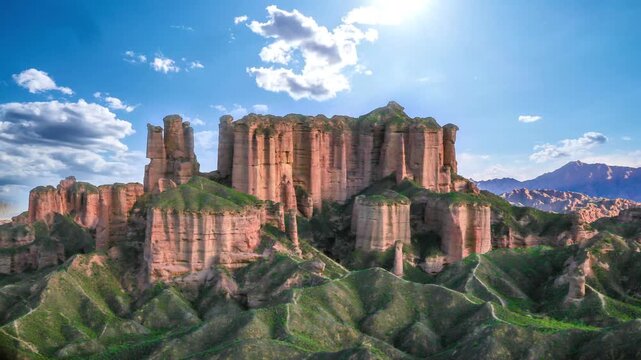 Stunning 4K aerial footage of Zhangye Danxia's rainbow mountains in Gansu, showcasing vibrant striped rocks and dramatic geological beauty under golden light.
