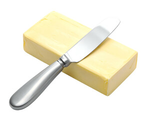 Brightly lit golden butter block with a shiny knife